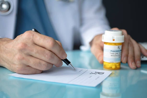 A healthcare provider writing Prescription